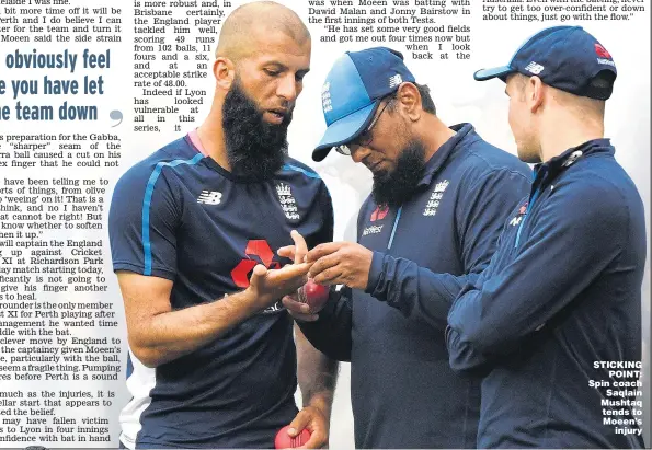  ??  ?? STICKING POINT: Spin coach Saqlain Mushtaq tends to Moeen’s injury