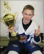  ?? SUBMITTED PHOTO ?? Mackenzie Entwistle holds the championsh­ip trophy as a member of the 2010 Toronto Marlboros minor peewee AAA team.