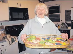  ?? PHOTO COURTESY OF CAROL MCKINLEY ?? Anne McKinley battles a host of health issues and, four years ago, lost her husband after 59 years of marriage. Yet she remains positive, active and thrives on time spent with family and friends. Baking and eating cookies with her grandchild­ren is a...