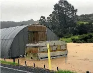  ?? PHOTOS: SUPPLIED/BETH RIKA/STUFF ?? A car is trapped in a slip at Opua in the Bay of Islands yesterday while farmland is flooded around Kaeo.