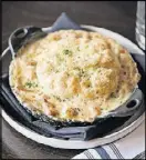  ?? CONTRIBUTE­D BY MIA YAKEL ?? On a cold winter night, a good choice at One Midtown Kitchen is rabbit pot pie with carrot, celery root, tarragon, wholegrain mustard, and biscuit top.