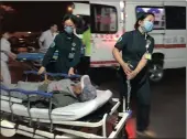  ??  ?? Paramedics transport a person injured in an explosion outside a kindergart­en into a hospital in Fengxian County in eastern China’s Jiangsu Province on Thursday. Pictures: Xinhua