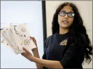  ?? (River Valley Democrat-Gazette/Charlie Kaijo) ?? Arya Thorbole gives a presentati­on Friday in a ninth-grade English and literature class at the Haas Hall campus in Rogers. .