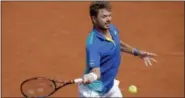  ?? MICHEL EULER — THE ASSOCIATED PRESS ?? Switzerlan­d’s Stan Wawrinka returns the ball to Ukraine’s Alexandr Dolgopolov during their second round match of the French Open Thursday in Paris.