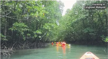  ??  ?? Kayaking in Langkawi, Malaysia