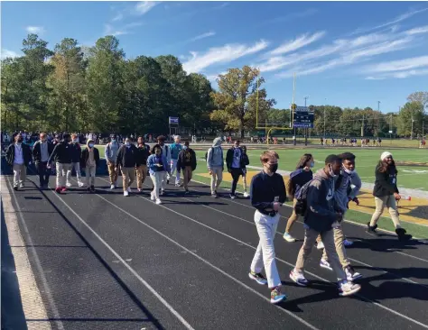  ?? (Pine Bluff Commercial/
Byron Tate) ?? October was anti-violence and anti-bullying month, and as a show of support, Watson Chapel students marched around the high school track on Monday.