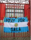  ??  ?? „ A tribute flag to missing Argentine footballer Emiliano Sala.