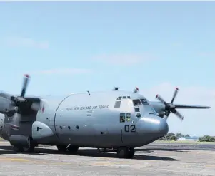  ?? ?? Entry to the Hercules C-130H at Base Ohakea was through a side hatch behind the cockpit.