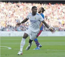  ?? AFP ?? Real Madrid defender David Alaba celebrates after scoring the team’s first goal at the Camp Nou yesterday