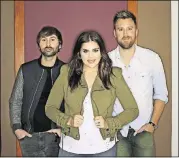  ?? AP PHOTO / MARK HUMPHREY ?? “Heart Break” is the fifth No. 1 album for Lady Antebellum — (from left) Dave Haywood, Hillary Scott and Charles Kelley. The Grammy-winning group’s tour arrives Friday in Alpharetta.