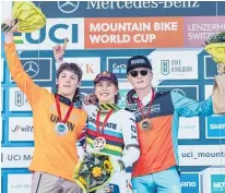  ?? Photo / Bartek Wolinski ?? Lachlan Stevens-mcnab (left) on the podium after the junior men’s downhill at the latest round of the UCI Mountain Bike World Cup in Switzerlan­d.