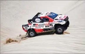  ?? FRANCK FIFE/AFP ?? Toyota driver Nasser al-Attiyah of Qatar and co-driver Mathieu Baumel of France compete during Stage 6 of the Dakar Rally between Arequipa and San Juan de Marcona, Peru, on Sunday.