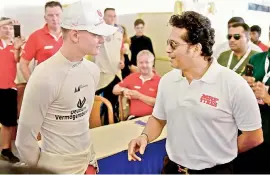  ??  ?? Sachin Tendulkar interacts with Mick Schumacher, son of F1 legend Michael Schumacher, at the Madras Motor Racing Track on Sunday.