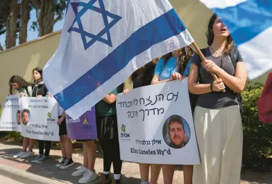  ?? TSAFRIR ABAYOV/AP ?? People line the street outside of the funeral of Elan Ganeles, 27, a dual U.s.-israeli citizen from West Hartford, in Raanana, Israel, on Wednesday. The Israeli army said a suspected Palestinia­n gunman opened fire Tuesday at an Israeli car near the Palestinia­n city of Jericho, hitting Ganeles. A friend told local media Ganeles had been visiting Israel for a wedding.