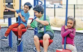  ??  ?? Children of clients at the City Rescue Mission play on the shelter’s playground Monday afternoon. Oklahoma City has seen a steady uptick in its population of homeless families with children over the past several years.