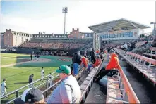  ?? [BRYAN TERRY, THE OKLAHOMAN] ?? Oklahoma State fans take their seats before the Cowboys' baseball home opener against Little Rock at Allie P. Reynolds Stadium in Stillwater.