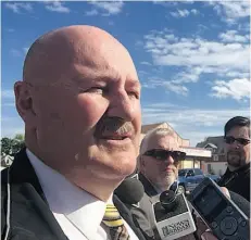  ?? PAIGE PARSONS/ EDMONTON JOURNAL ?? Staff Sgt. Bill Clark speaks to the media near the crime scene at 95th Street and 117th Avenue where Shawn Richard was found stabbed to death early Monday.