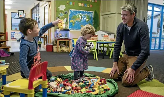  ?? IAIN McGREGOR/STUFF ?? Hadley McLachlan pictured with his children, George, 5, and Lucy, 2, at Fairleigh Kindergart­en. He says many kindergart­ens rely on grants, donations and events to raise money for resources and operationa­l costs.