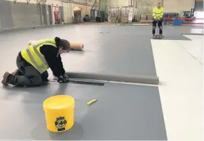  ??  ?? Gerflor Tarasafe vinyl safety flooring being installed over F Ball Stopgap Isolator membrane at Salutethe NHS project.