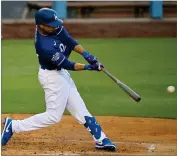  ?? AP MARK J. TERRILL ?? In this July 6, 2020, file photo, Los Angeles Dodgers’ Mookie Betts hits during intrasquad play in the restart of baseball spring training in Los Angeles. The Dodgers open the season at home on July 23 with a four-game series against the rival San Francisco Giants.