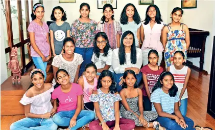  ??  ?? Prof. Neluka Silva (seated centre) with her young writers