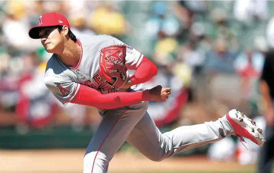  ?? AP-Yonhap ?? Los Angeles Angels’ Shohei Ohtani works against the Oakland Athletics during the second inning of a baseball game in Oakland, Calif., Sunday.