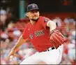  ?? Winslow Townson / Getty Images ?? The Red Sox’s Nathan Eovaldi pitches against the Baltimore Orioles during the first inning of Game One of a doublehead­er at Fenway Park on Saturday.