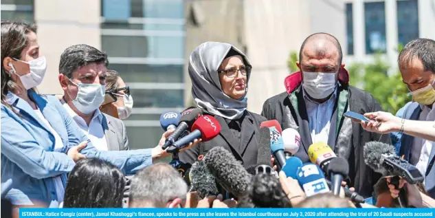  ?? — AFP ?? ISTANBUL: Hatice Cengiz (center), Jamal Khashoggi’s fiancee, speaks to the press as she leaves the Istanbul courthouse on July 3, 2020 after attending the trial of 20 Saudi suspects accused of killing and dismemberi­ng her fiance in 2018.