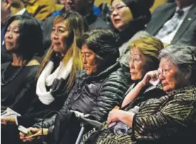  ?? Andy Cross, The Denver Post ?? Leslie Sakato, right, daughter of George Sakato, wipes away a tear during her father’s memorial service at the Heritage Christian Center on Saturday.