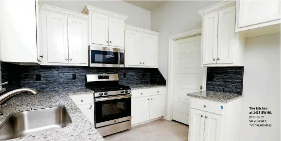  ?? [PHOTOS BY STEVE SISNEY, THE OKLAHOMAN] ?? The kitchen at 1417 SW 96.