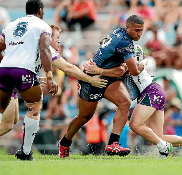  ??  ?? Chris Satae of the Warriors charges forward against a weakened Storm team in Rotorua yesterday.