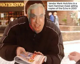  ?? ?? Vendor Mark Hutchins in a Sam Hamman mask selling copies of the Echo in 2001