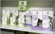 ?? ANDREW SELSKY — THE ASSOCIATED PRESS ?? Marijuana products for dogs are lined up on a shelf in the Bend Veterinary Clinic in Bend, Ore. People anxious to relieve suffering in their pets are increasing­ly turning to oils and powders that contain CBDs, a non-psychoacti­ve component of marijuana,...