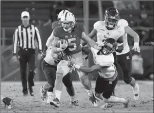  ?? The Associated Press ?? RUNNING TO THE TOP: In this Nov. 26, 2016, file photo, Stanford running back Christian McCaffrey (5) runs the ball during an NCAA football game against Rice in Stanford, Calif. After running backs failed to go in the first round of the NFL draft in...