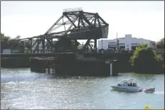  ?? NEWS-SENTINEL FILE PHOTOGRAPH ?? A boat on the San Joaquin Delta passes a bridge in Walnut Grove on July 11, 2015.