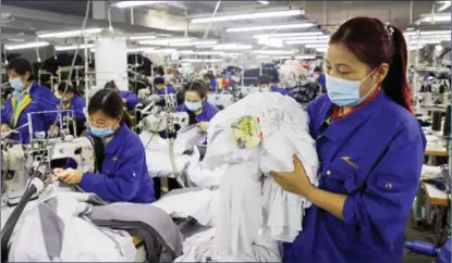  ?? FAN CHANGGUO / XINHUA ?? A garment factory in Linyi city, Shandong province, is part of the poverty-alleviatio­n efforts.