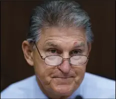  ?? J. SCOTT APPLEWHITE/AP PHOTO ?? In this file photo Sen. Joe Manchin, D-W.Va., prepares to chair a hearing in the Senate Energy and Natural Resources Committee.