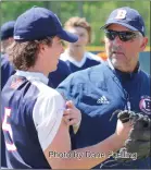  ?? Photo by Dane Fuelling ?? Veteran Bellmont assistant coach Mark Okoniewski imparts his wisdom to senior Isaiah Wellman.