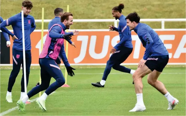  ?? Associated Press ?? ↑
England players attend a training session at St George’s Park on Monday.