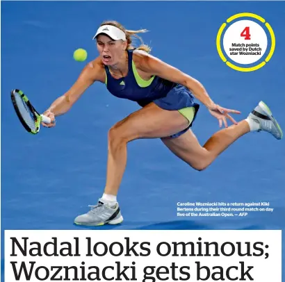  ?? AFP ?? Caroline Wozniacki hits a return against kiki Bertens during their third round match on day five of the australian open. —
