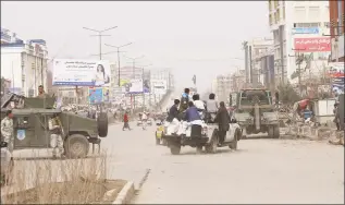  ?? Tamana Sarwary / Associated Press ?? Afghans carried injured people after an attack in Kabul, Afghanista­n, on Friday. Gunmen in Kabul attacked a remembranc­e ceremony for a minority Shiite leader on Friday.