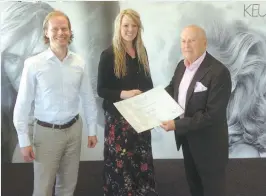  ??  ?? Chloe Webb from Lina Patina Warragul, receiving her certificat­e from left: Eelco Keune and George Keune, after she completed her Keune Internatio­nal Master Colourist training in Amsterdam, Holland.