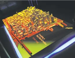  ??  ?? A 3-D map of S.F. is displayed at the conference by Here, a mapping firm whose work underlies most U.S. and European car navigation systems.