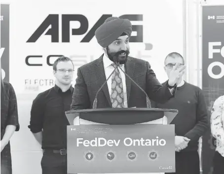  ?? NICK BRANCACCIO ?? Economic Developmen­t Minister Navdeep Bains announces $5 million of funding for two Windsor automotive sector plants Monday at APAG Elektronik Corp. in Windsor.