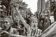  ??  ?? Protesters take to the streets Saturday in Yangon. The military placed heavy restrictio­ns on internet use.