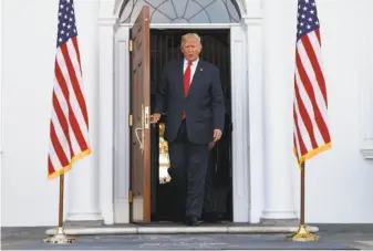  ?? Evan Vucci / Associated Press ?? President Trump arrives to speak to reporters at Trump National Golf Club in Bedminster, N.J. He declined to explicitly say he was considerin­g a preemptive strike against North Korea.