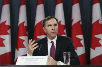  ?? CHRIS WATTIE/REUTERS ?? Federal Finance Minister Bill Morneau said Friday that the $2.3-billion budgetary surplus promised for this year by Stephen Harper has turned into a $3-billion deficit due to falling oil prices and the sluggish world economy.