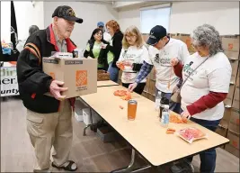  ?? CHRIS RILEY — THE REPORTER ?? Air Force veteran Richard Anderson picks up a Safe At Home Kit from the Rebuilding Together team during a giveaway at the Vacaville Veterans Memorial Building on Friday.