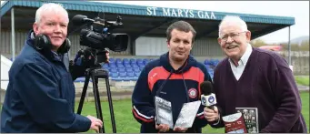  ??  ?? Stephen Donnelly (centre) with Christy Riordan (left) of CR Videos and John O’Sullivan at St Mary’s GAA grounds, Cahersivee­n.