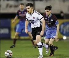  ??  ?? Luke Rossiter chases Dundalk’s Ronan Murray.